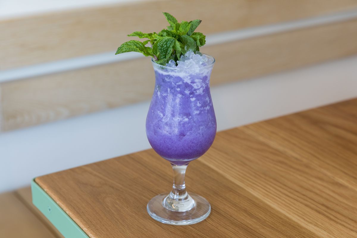 A purple-hued tropical cocktail