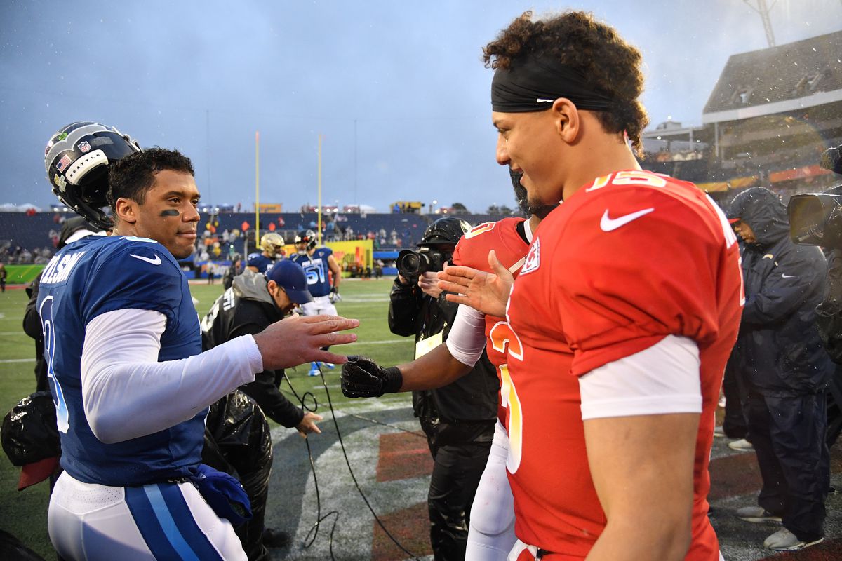 Russell Wilson #3 of the Seattle Seahawks shake hands with Patrick Mahomes #15 of the Kansas City Chiefs after the 2019 NFL Pro Bowl at Camping World Stadium on January 27, 2019 in Orlando, Florida.