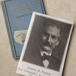 A book written about Utah and the Civil War lies next to a picture of Bashie Fisher Thomander's father, Joseph A. Fisher.