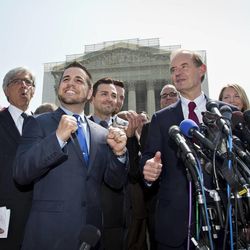 Plaintiffs in Hollingsworth v. Perry, the California Proposition 8 case, react to the 5-4 decision of the Supreme Court, Wednesday, June 26, 2013, outside the court in Washington. From left are, attorney Ted Boutrous, Jeff Zarrillo, and his partner Paul Katami, David Boies, and Sandy Stier and her partner Kris Perry. In two separate and significant victories for gay rights, the Supreme Court struck down a provision of a federal law denying federal benefits to married gay couples and cleared the way for the resumption of same-sex marriage in California.   (AP Photo/J. Scott Applewhite)