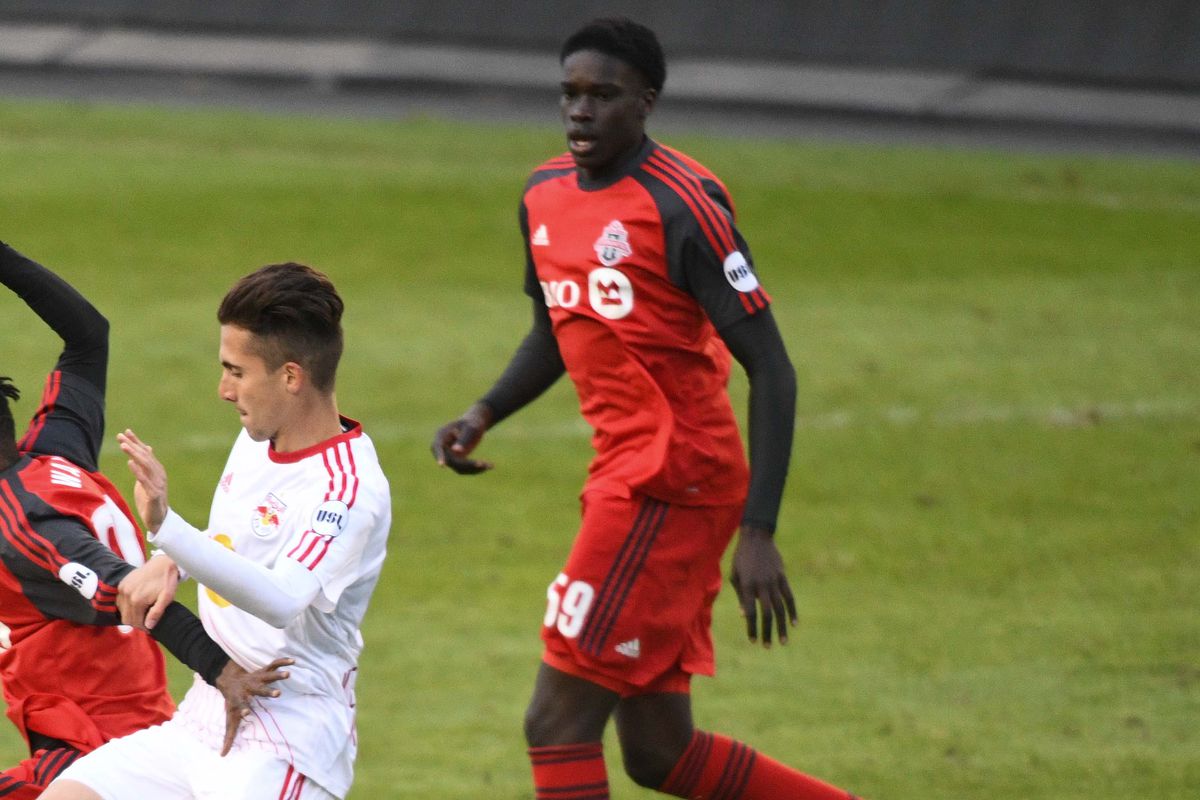 USL Photo - TFC II midfield duo of Noble Okello and Gideon Waja battle with NYRB II in the midfield at BMO Field in April