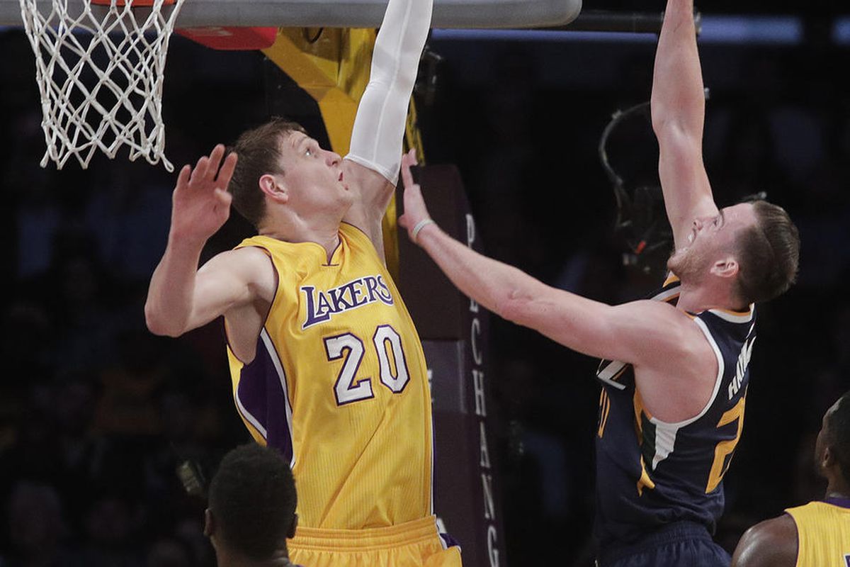Utah Jazz's Gordon Hayward, right, is defended by Los Angeles Lakers' Timofey Mozgov, of Russia, during the first half of an NBA basketball game Monday, Dec. 5, 2016, in Los Angeles. (AP Photo/Jae C. Hong)
