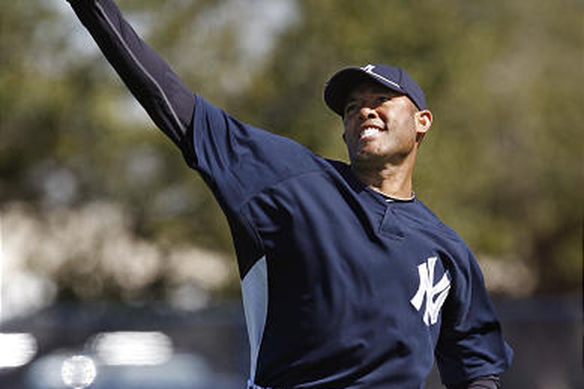 New York Yankees reliever Mariano Rivera throws long toss on the first day of workouts for pitchers and catchers at Steinbrenner Field in Tampa, Fla., Thursday.