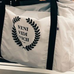 We were wondering how long it would take until this play on words sprouted up. The perfect way to take home all of your UMF paraphernalia? This $60 gym bag.  