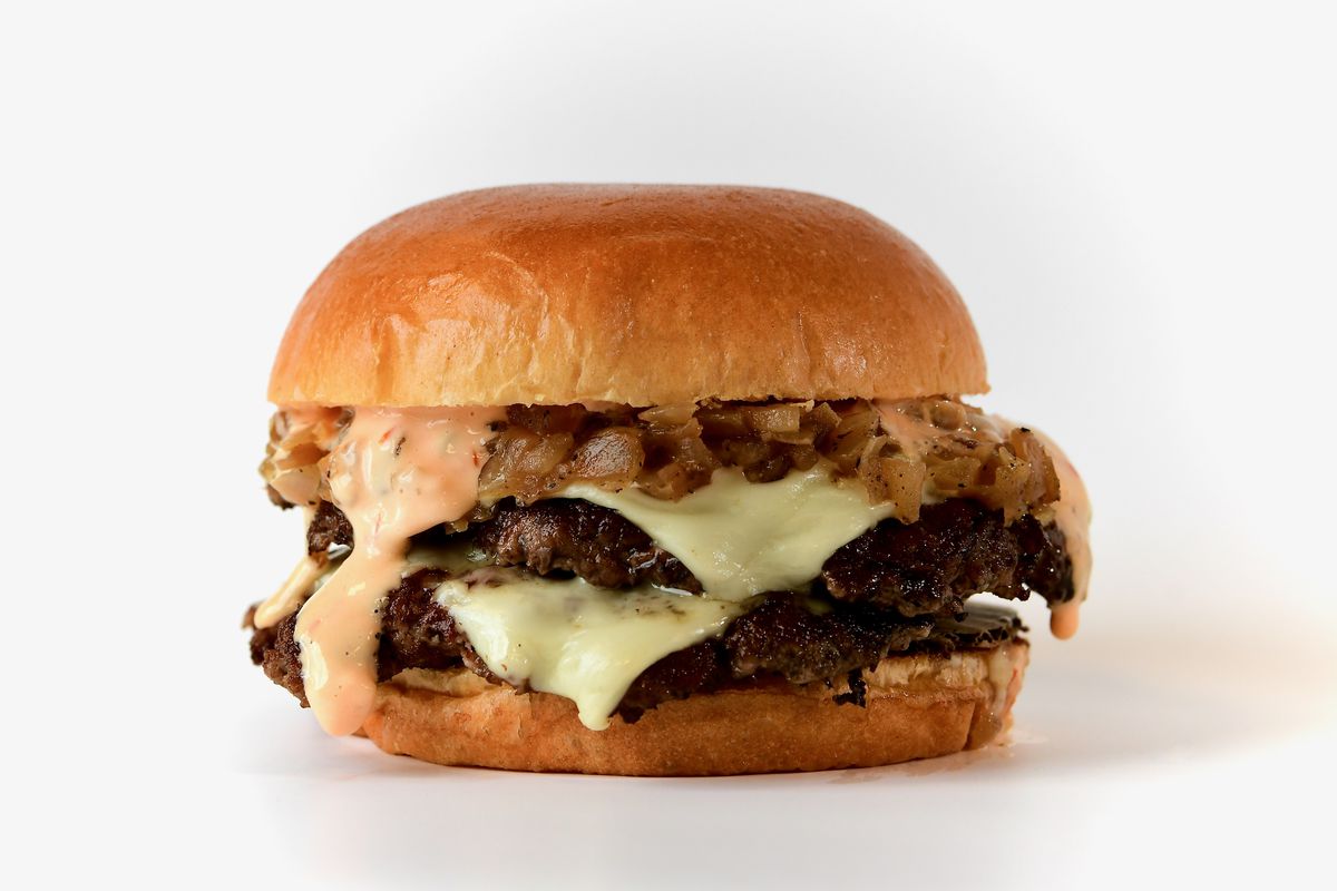 Original “OG” Double Crispy Burger wtih American cheese, grilled onions, Thousand Island on a brioche bun.