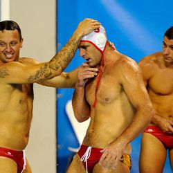 Players of Montenegro celebrate defeating Italy during the Water Polo Semifinal