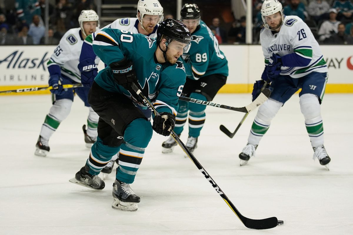 Feb 15, 2018; San Jose, CA, USA; San Jose Sharks center Chris Tierney (50) controls the puck against the Vancouver Canucks during the second period at SAP Center at San Jose.