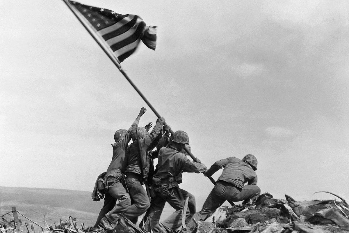 In this Feb. 23, 1945 file photo, U.S. Marines of the 28th Regiment, 5th Division, raise a U.S. flag atop Mount Suribachi, Iwo Jima. Strategically located 660 miles from Tokyo, the Pacific island became the site of one of the bloodiest, most famous battle