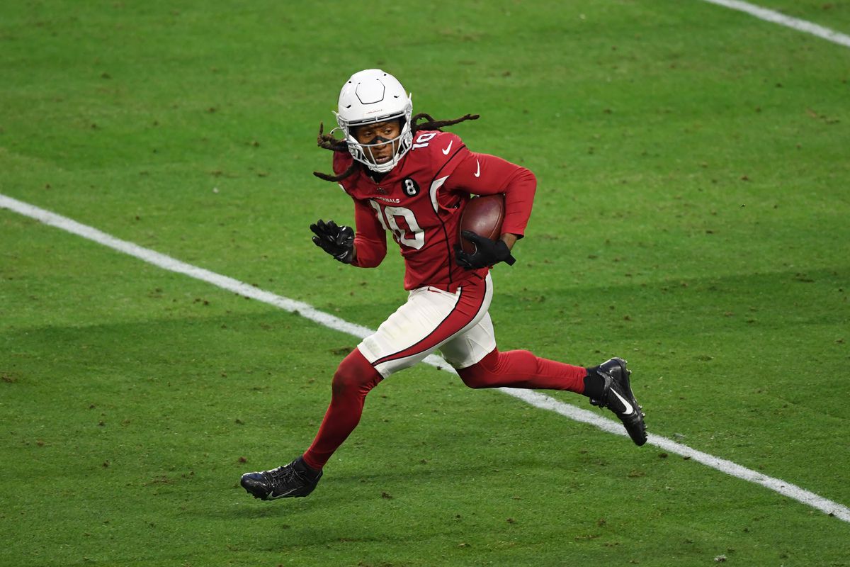 DeAndre Hopkins #10 of the Arizona Cardinals runs with the ball against the Philadelphia Eagles at State Farm Stadium on December 20, 2020 in Glendale, Arizona.