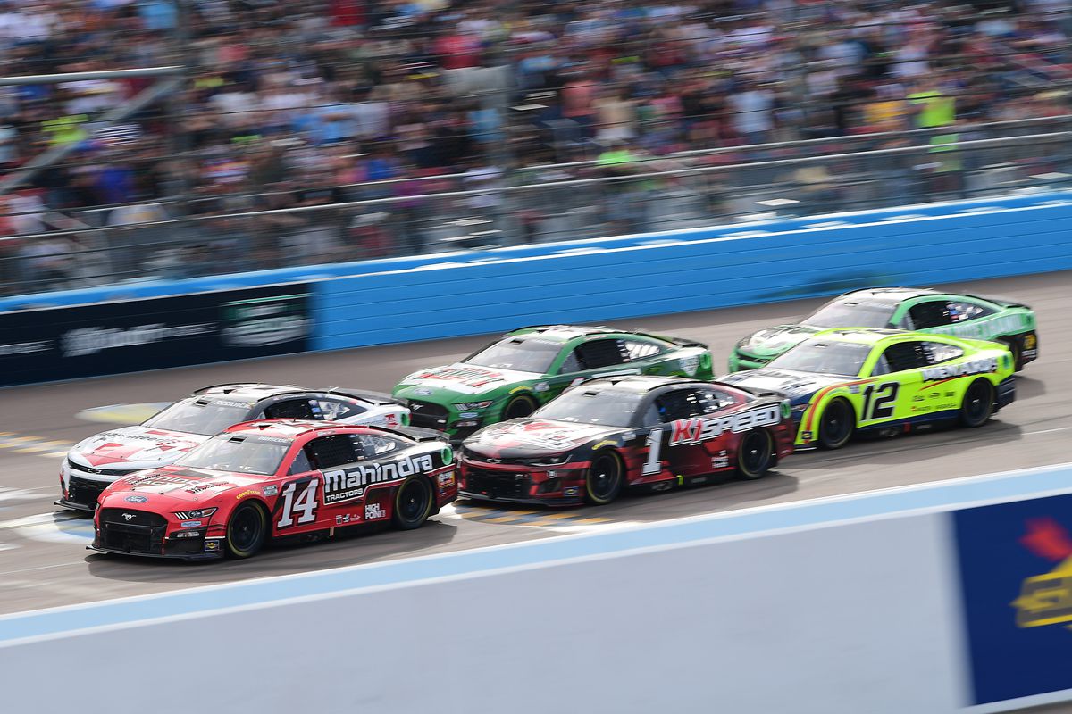 NASCAR Cup Series driver Chase Briscoe (14) leads the group of driver Tyler Reddick (8) driver Ross Chastain (1) driver Kevin Harvick (4) driver Ryan Blaney (12) and driver Austin Dillon (3) during the Ruoff Mortgage 500 at Phoenix Raceway.