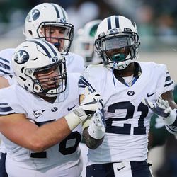 Brigham Young Cougars running back Jamaal Williams (21) celebrates his touchdown against the Michigan State Spartans  in East Lansing, MI on Saturday, Oct. 8, 2016. BYU won 31-14.  in East Lansing, MI on Saturday, Oct. 8, 2016. BYU won 31-14.