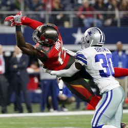 Tampa Bay Buccaneers wide receiver Josh Huff (15) is unable to make a catch as Dallas Cowboys' Anthony Brown (30) defends in the second half of an NFL football game, Sunday, Dec. 18, 2016, in Arlington, Texas. 