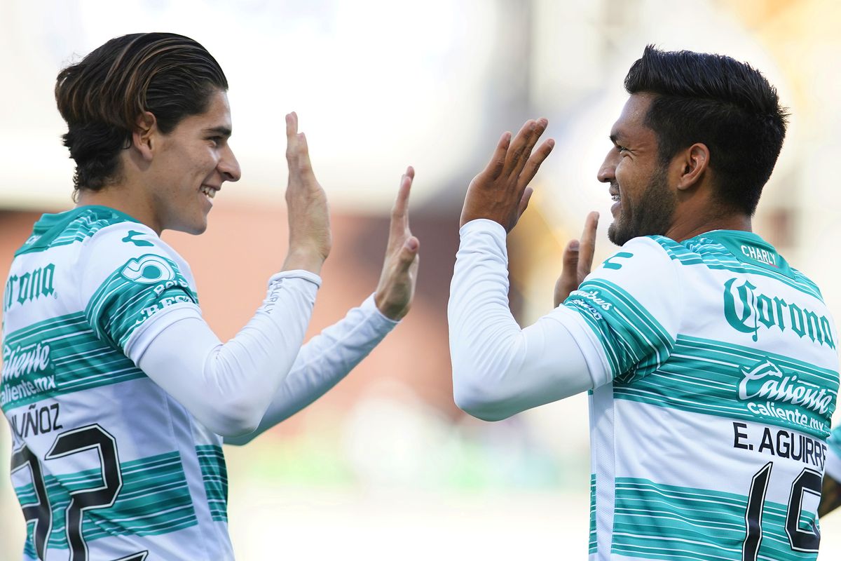 Eduardo Aguirre (R) of Santos celebrates with Santiago Muñoz (L) after scoring his team’s first goal during the 15th round match between Santos Laguna and Toluca as part of the Torneo Guard1anes 2021 Liga MX at Corona Stadium on April 18, 2021 in Torreon, Mexico.