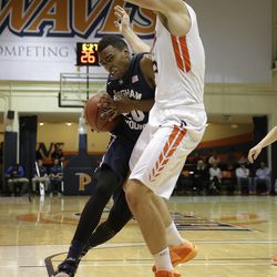 BYU's Anson Winder, left, drives against Pepperdine's Jett Raines during the first half of an NCAA college basketball game Thursday, Feb. 5, 2015, in Malibu, Calif.