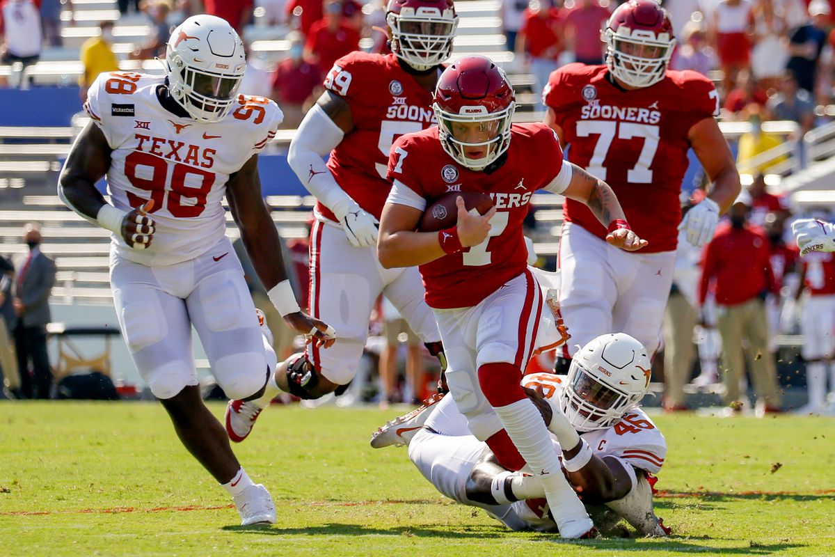 Oklahoma Sooners quarterback Spencer Rattler is tackled from behind by Texas Longhorns linebacker Joseph Ossai during the first quarter of the Red River Showdown at Cotton Bowl.