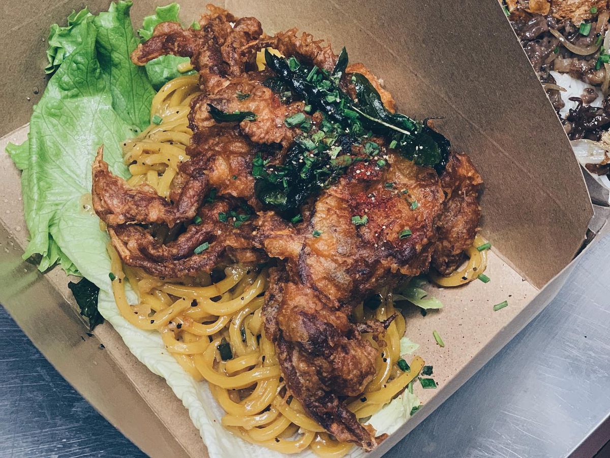 Soft shell crab with black pepper noodles at Ba Sa in a takeout container