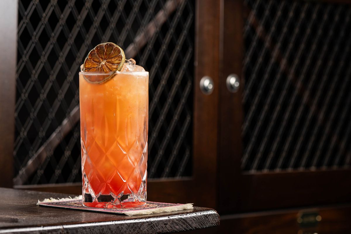 A bright orange cocktail at the Rendition Room.