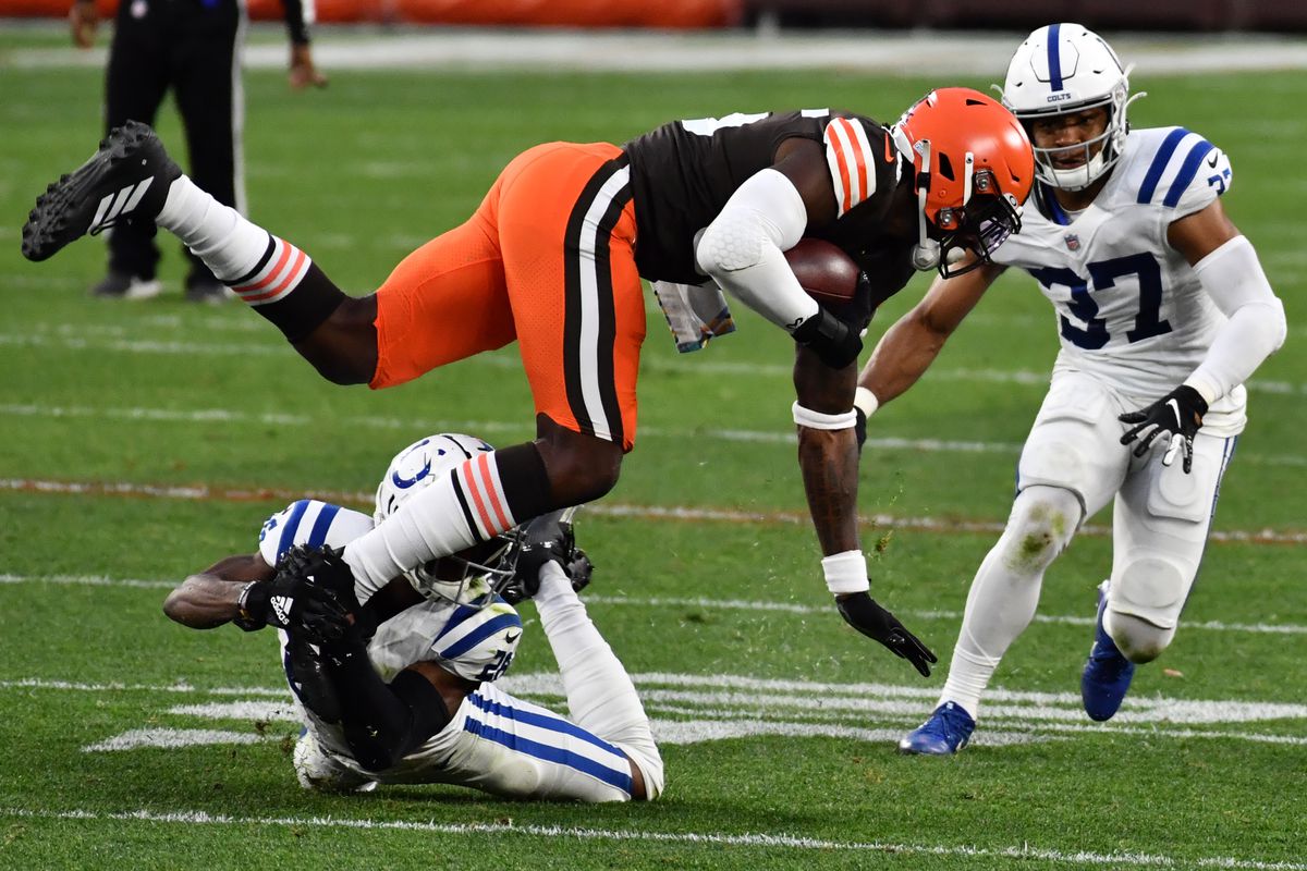 Colts cornerback Rock Ya-Sin (26) upends Cleveland Browns tight end David Njoku (85) during the second half at FirstEnergy Stadium.