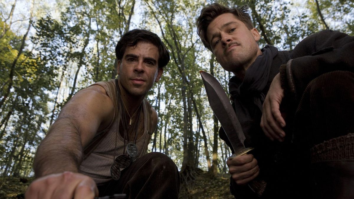 Both men look directly down into the camera, with Pitt wielding a knife.