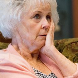 Linda Garfield, of Mona, gathers her thoughts as she and her husband, Rex, talk about how they were defrauded of their retirement savings by investment adviser Tom Andrews on Tuesday, Sept. 13, 2016.