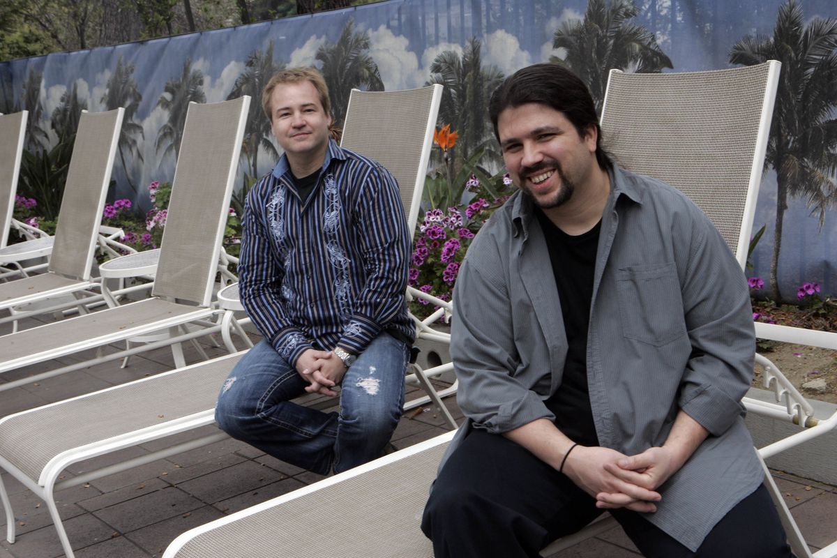 A photo of Vince Zampella and Jason West sitting on deck chairs