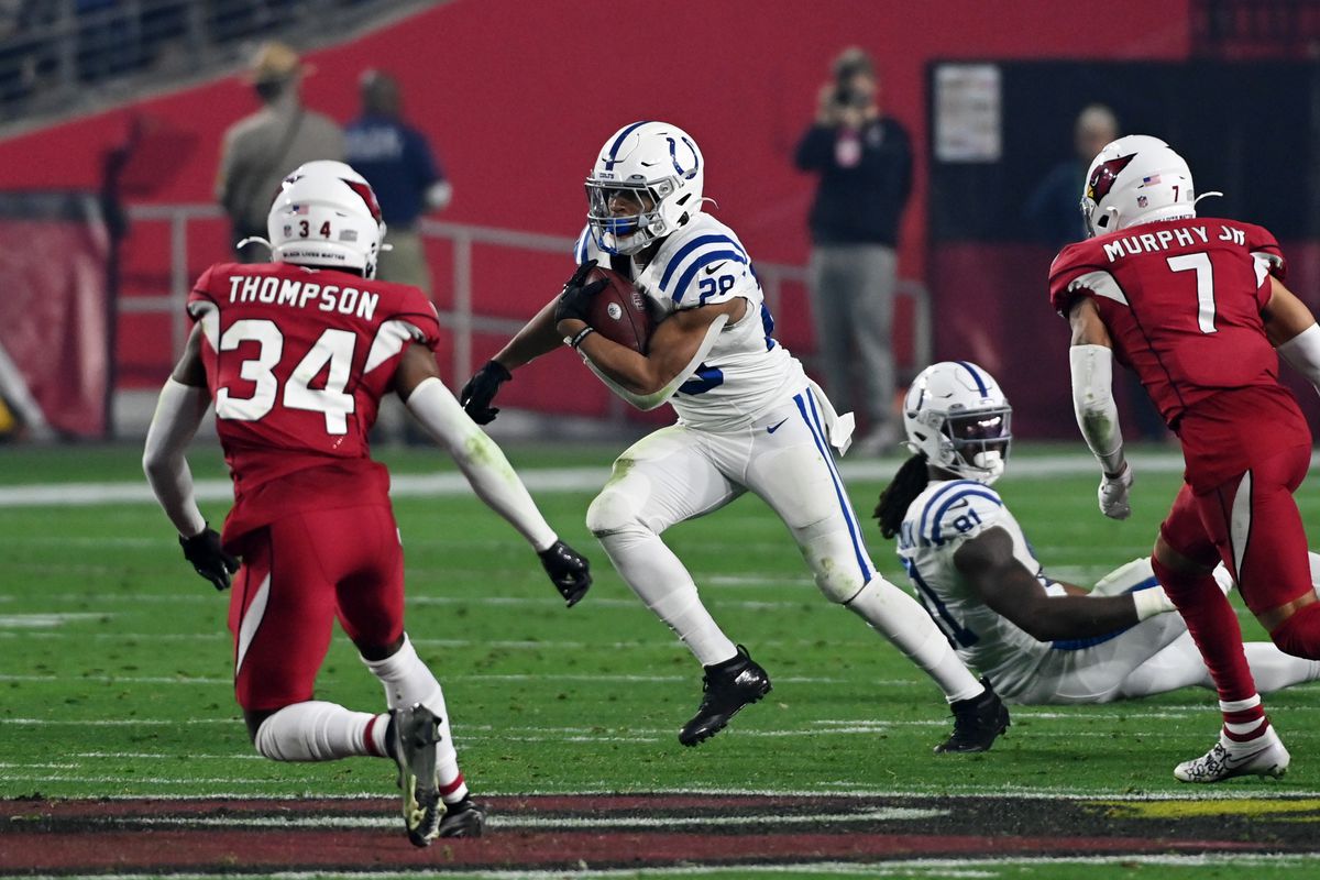 Jonathan Taylor #28 of the Indianapolis Colts runs with the ball against the Arizona Cardinals at State Farm Stadium on December 25, 2021 in Glendale, Arizona.