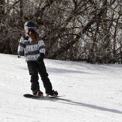 Shriners Hospital patient Izy Hicks practices snowboarding at the annual Un-limb-ited Winter Camp at Park City Mountain Resort in Park City Thursday, Feb. 5, 2015.