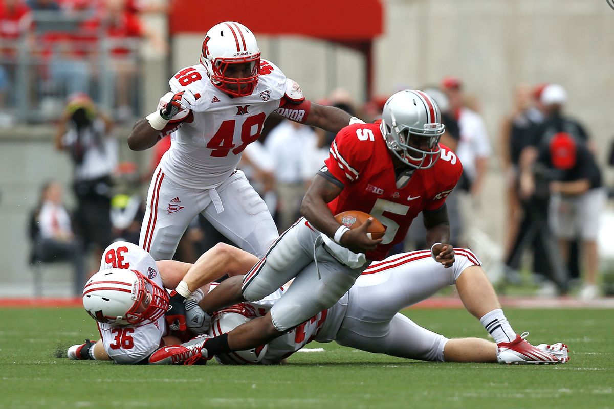 Chris Wade, joining in a gang sack of Braxton Miller.