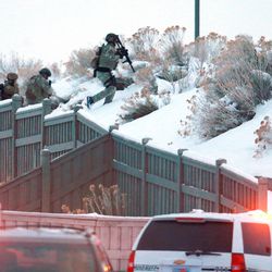 Utah County SWAT members respond to a suicidal barricaded man near the Ranches Golf Club in Eagle Mountain on Monday, Dec. 28, 2015. 