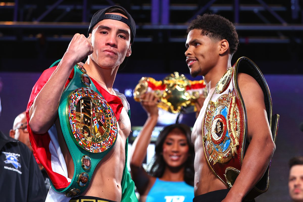 Oscar Valdez (L) and Shakur Stevenson (R) face-off during the weigh in prior to their WBC and WBO junior lightweight championship at MGM Grand Garden Arena on April 29, 2022 in Las Vegas, Nevada.