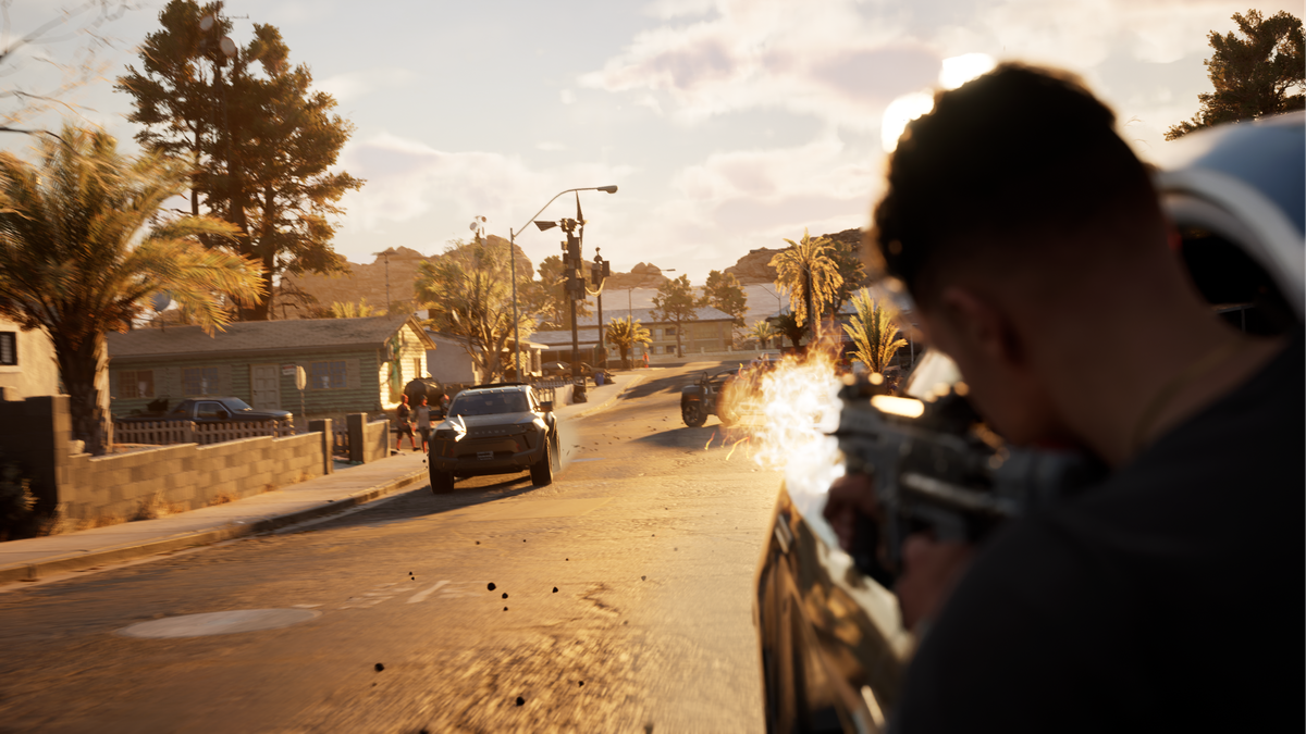 A man leans out of a car firing a gun in a Los Angeles street in MindsEye