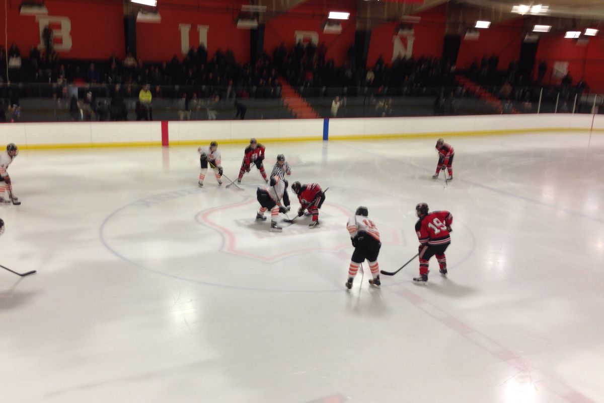 Woburn and Reading line up for the opening face off at O'Brien Rink.