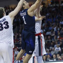 Brigham Young Cougars guard Chase Fischer (1) drives on Gonzaga Bulldogs forward Kyle Wiltjer (33) during the WCC tournament in Las Vegas Monday, March 7, 2016. BYU lost 88-84.