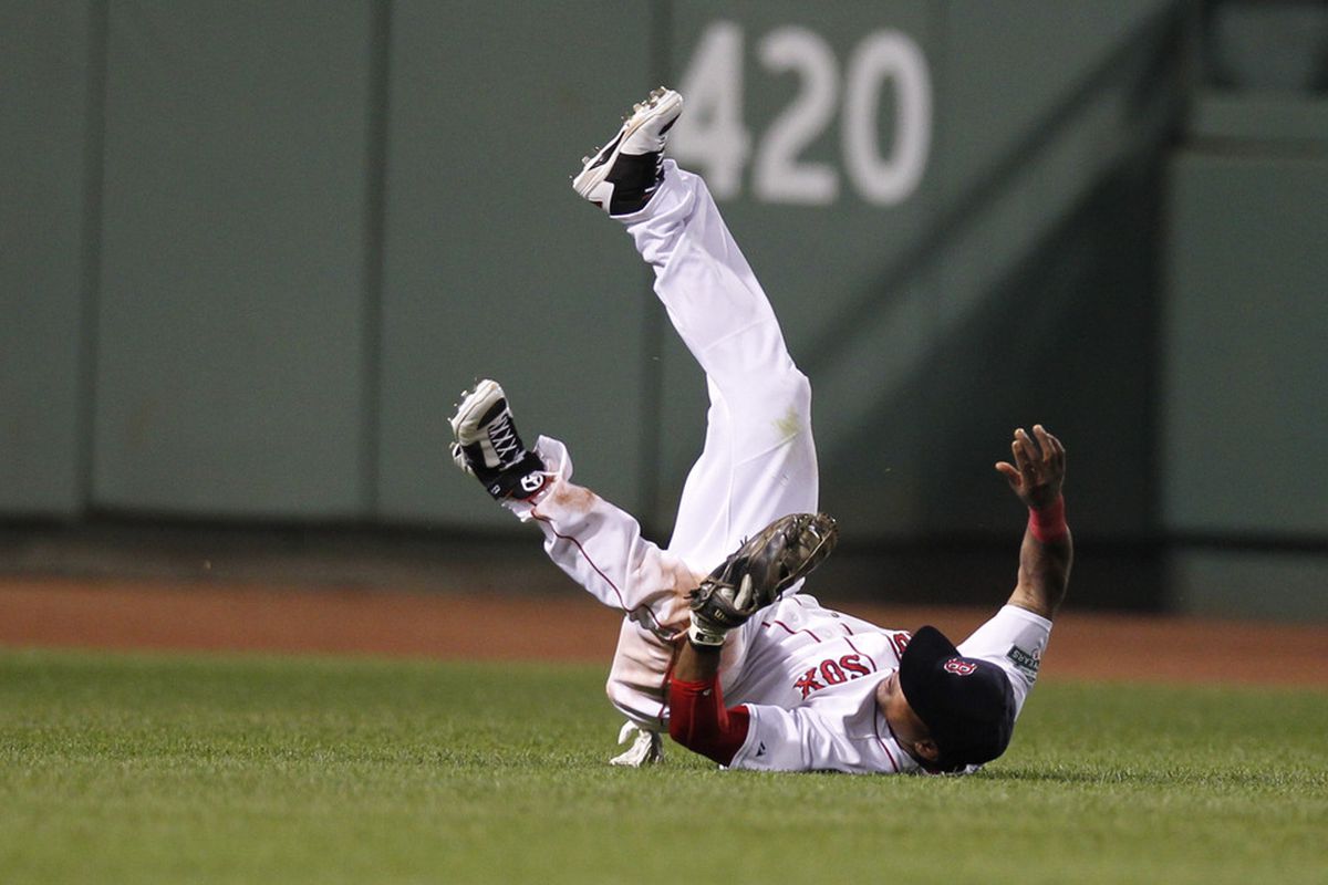 May 30, 2012; Boston, MA, USA; Boston Red Sox center fielder Marlon Byrd (23) makes a catch for the last out during the eighth inning against the Detroit Tigers at Fenway Park.  Mandatory Credit: Greg M. Cooper-US PRESSWIRE