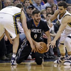 Utah Jazz's Joe Ingles, left, and Raul Neto, right, trap Minnesota Timberwolves guard Ricky Rubio (9) during the second half of an NBA basketball game Friday, April 1, 2016, in Salt Lake City. The Jazz won 98-85.