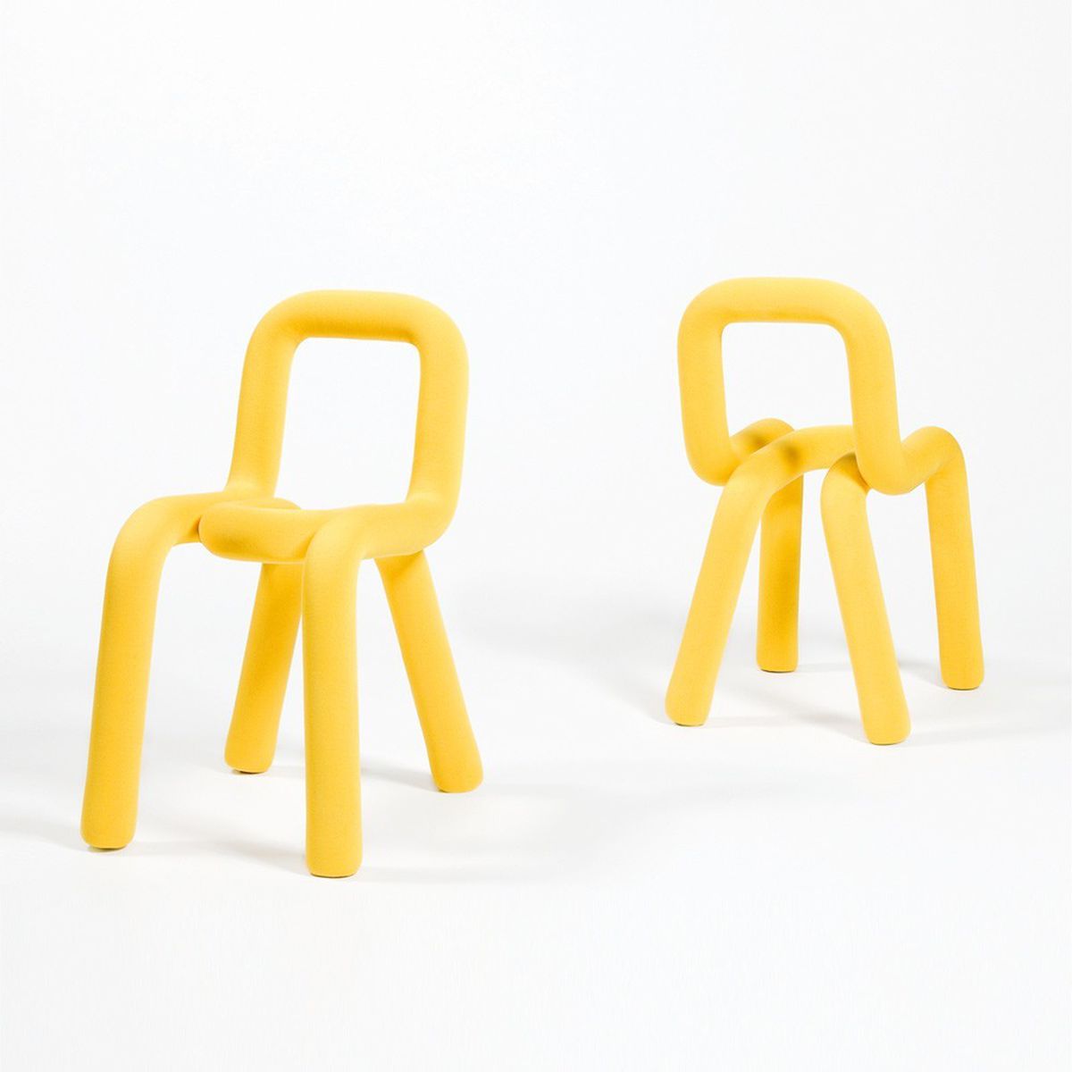 Yellow chairs made of tubular frames.