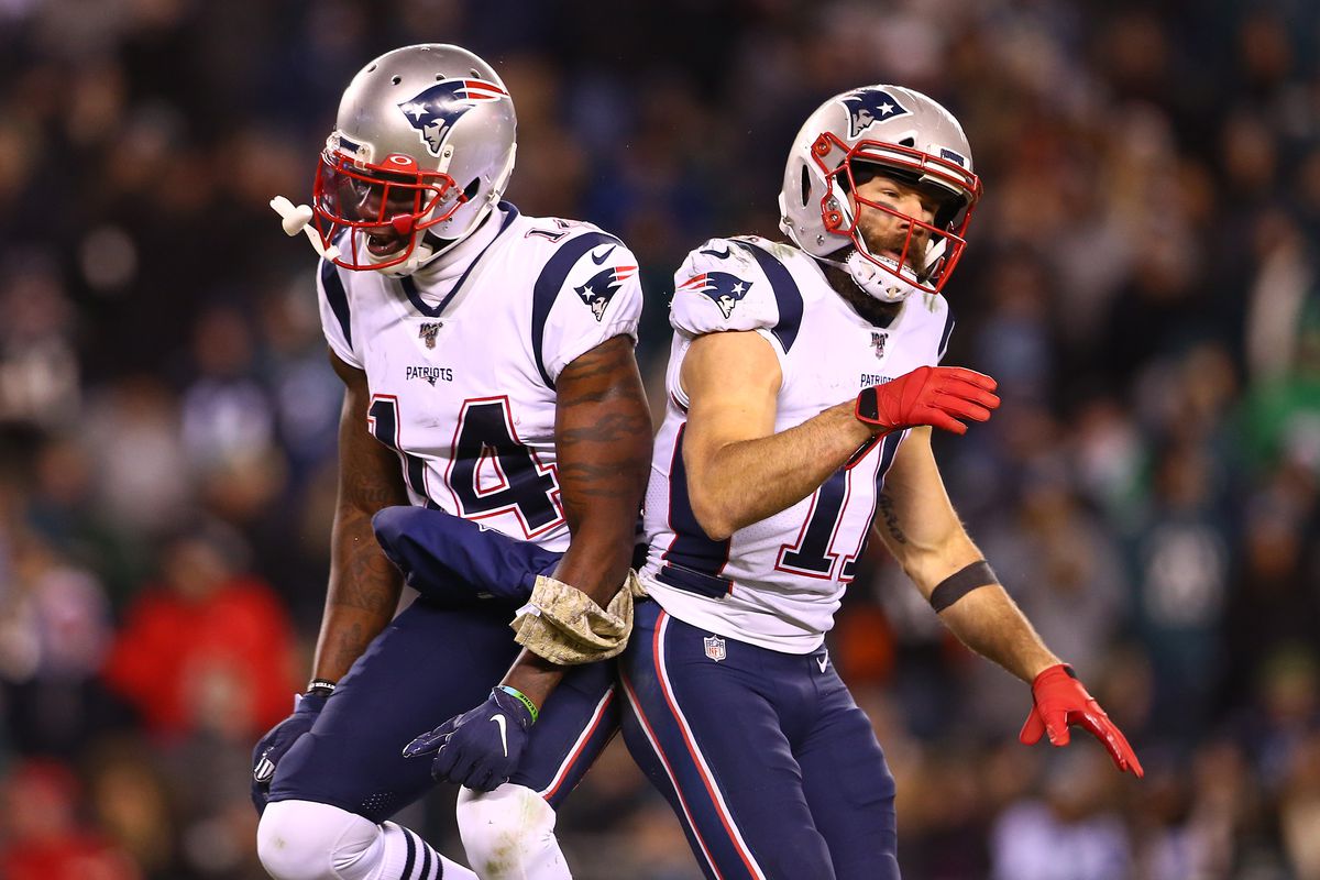 Julian Edelman of the New England Patriots celebrates with Mohamed Sanu after throwing a touchdown pass to Phillip Dorsett II during the third quarter against the Philadelphia Eagles at Lincoln Financial Field on November 17, 2019 in Philadelphia, Pennsylvania.