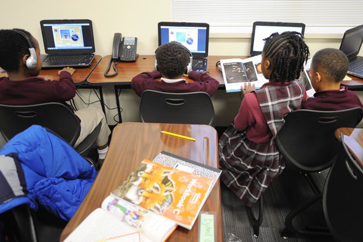 Second-graders work on computers at Tindley.