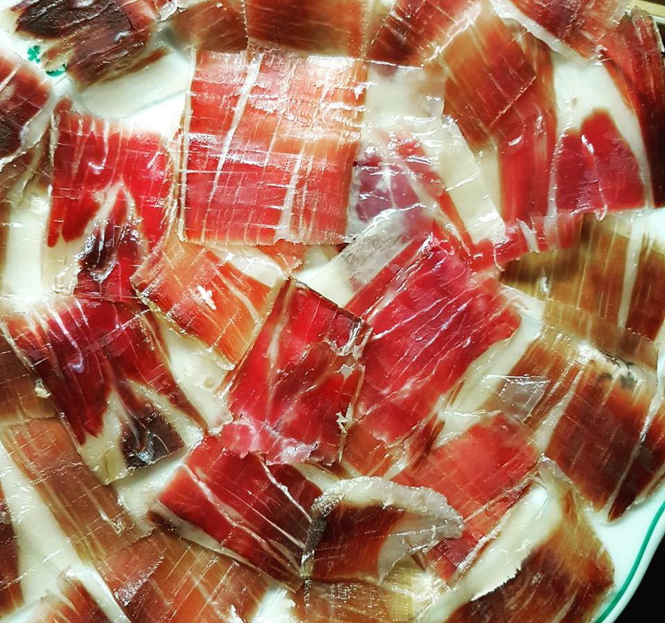 From above, swirls of Iberico ham