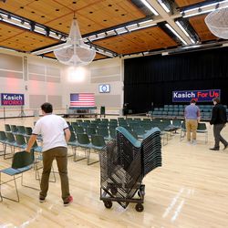 Workers get the Grande Ballroom ready for Ohio Gov. John Kasich to hold a town hall meeting at Utah Valley University, Friday, March 18, 2016.