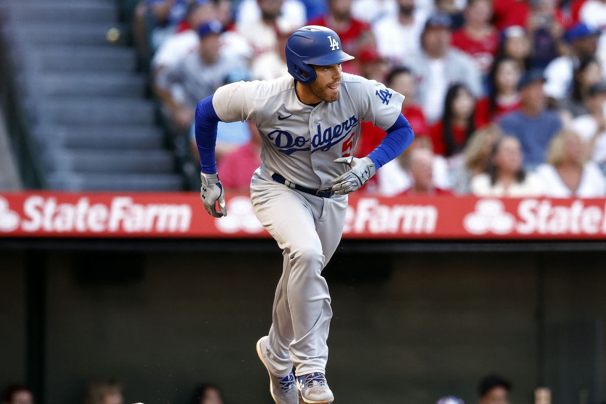 Freddie Freeman #5 of the Los Angeles Dodgers hits a rbi single against the Los Angeles Angels in the first inning at Angel Stadium of Anaheim on July 15, 2022 in Anaheim, California.
