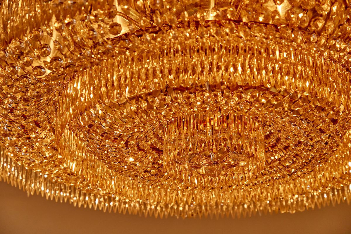 A crystal chandelier at Les Trois Chevaux is from the Waldorf Astoria circa 1931.