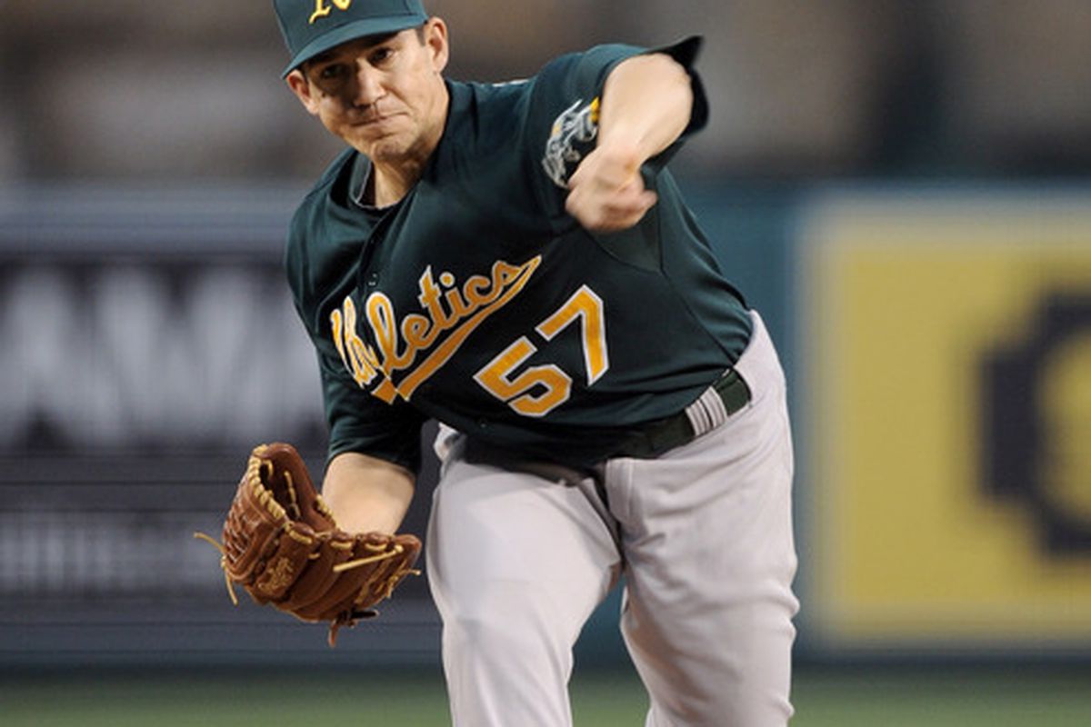 ANAHEIM, CA - APRIL 19:  Tommy Milone #57 of the Oakland Athletics putches against the Los Angeles Angels during the first inning at Angel Stadium of Anaheim on April 19, 2012 in Anaheim, California.  (Photo by Harry How/Getty Images)