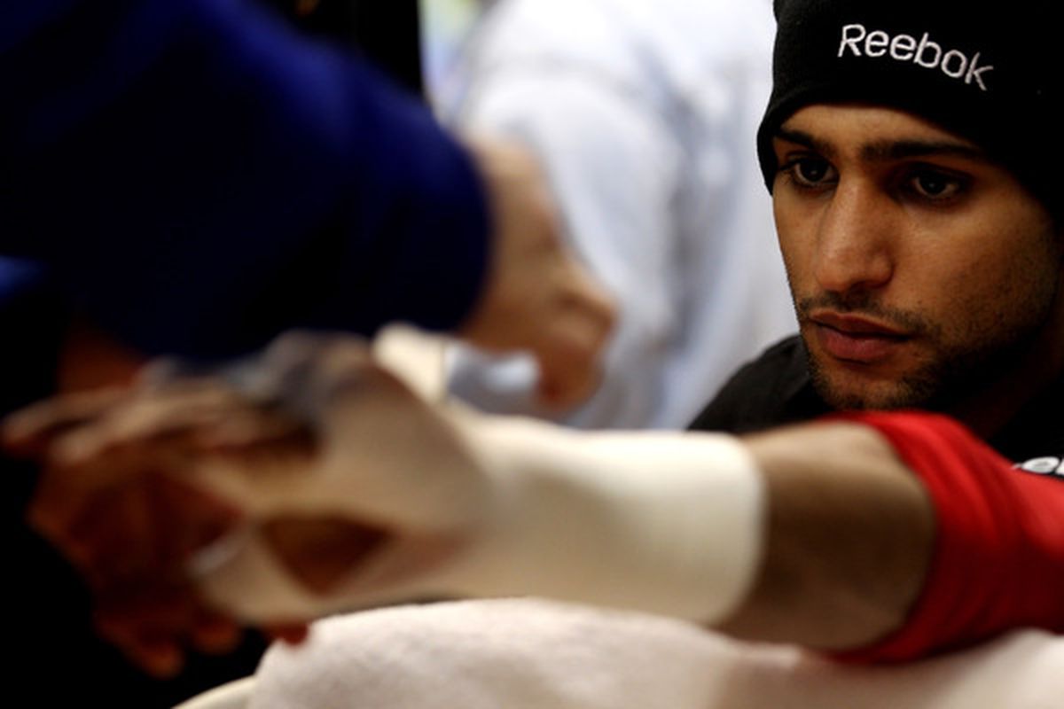 Amir Khan could lose about £1 million due to Sky's decision to bump his April 16 fight from pay-per-view. (Photo by Scott Heavey/Getty Images)