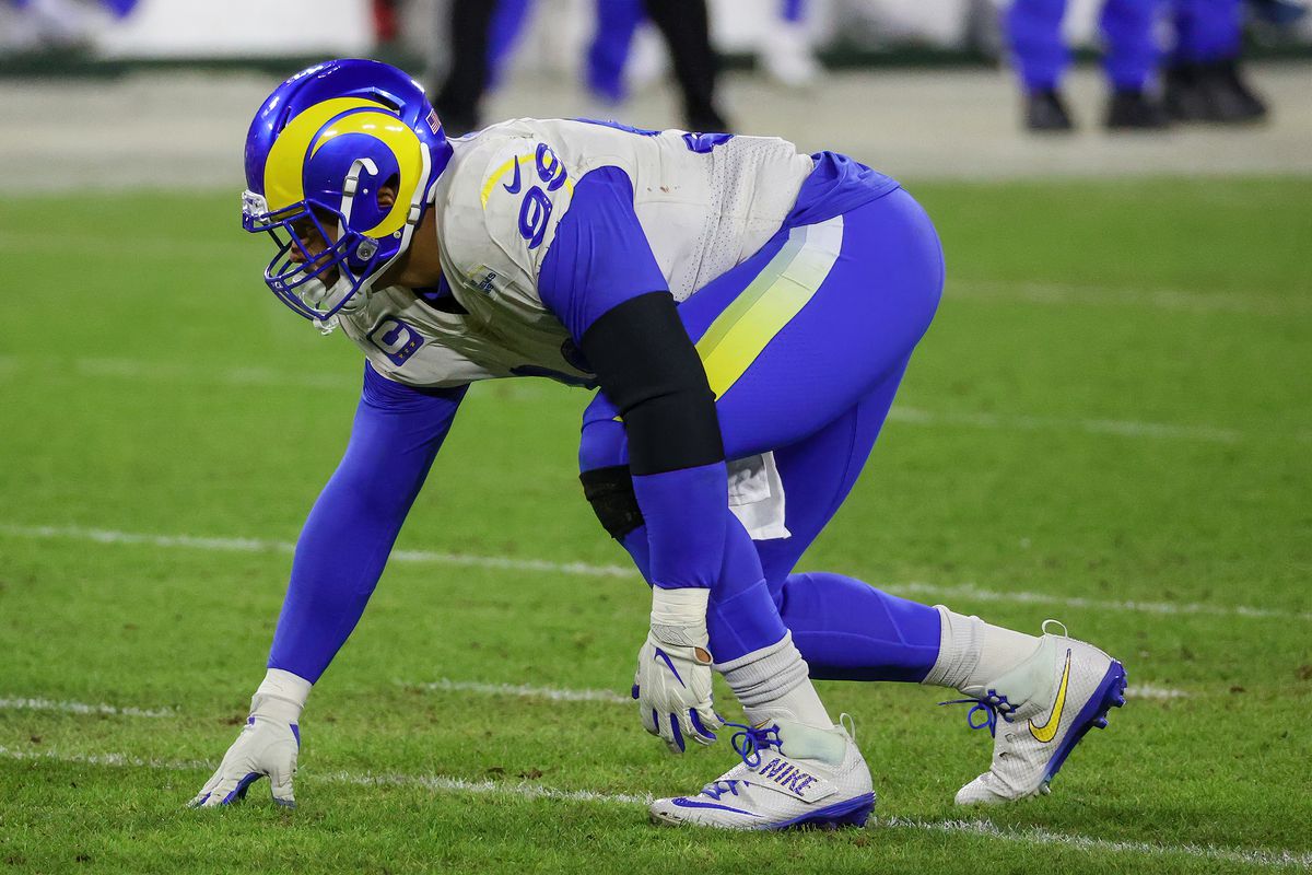 Aaron Donald of the Los Angeles Rams lines up for a play in the fourth quarter against the Green Bay Packers during the NFC Divisional Playoff game at Lambeau Field on January 16, 2021 in Green Bay, Wisconsin.