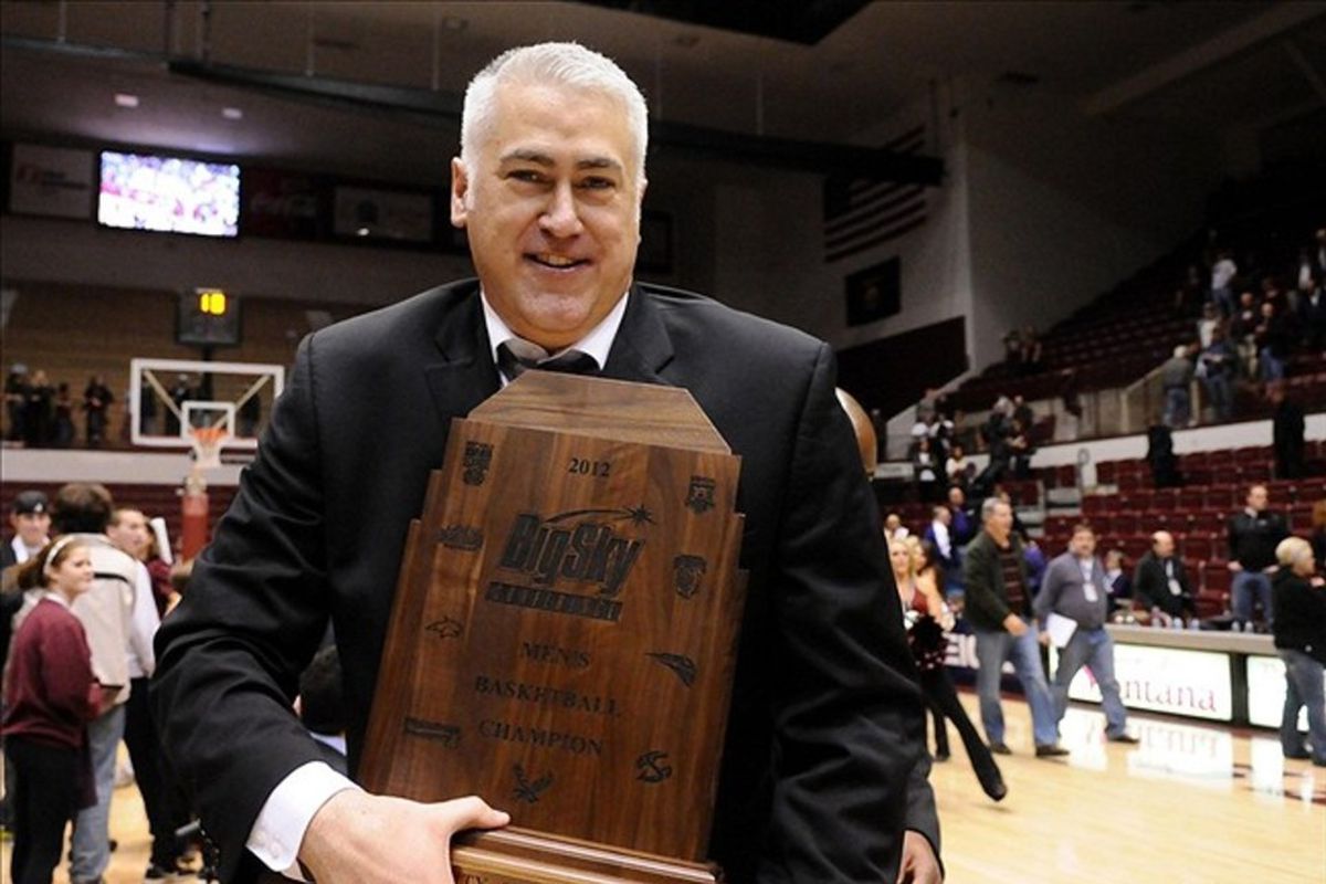 Mar 7, 2012; Missoula, MT, USA; Montana Grizzlies head coach Wayne Tinkle holds the Big Sky championship trophy after defeating the Weber State Wildcats after the finals of the 2012 Big Sky Tournament at Adams Center. Montana won 85-66.