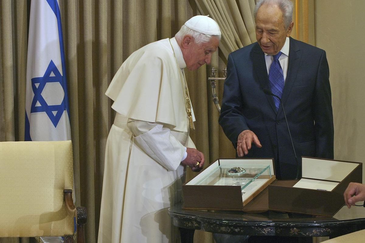 Israeli President Shimon Peres presents Pope  Benedict XVI with a gift of a Nano- Bible, developed by Israeli Technion, during their meeting in Jerusalem, Monday, May 11, 2009. The Pope called for the establishment of an independent Palestinian homeland i