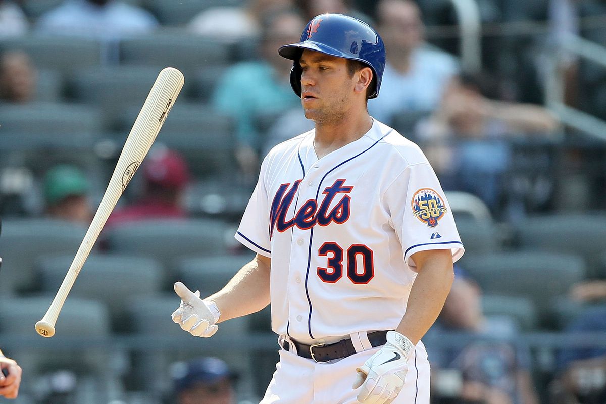 Josh Thole and the New York Mets have had no use for their bats lately.  (Photo by Jim McIsaac/Getty Images)