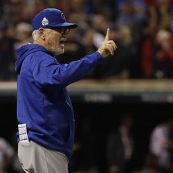 Chicago Cubs manager Joe Maddon questions a review during the ninth inning of Game 7 of the Major League Baseball World Series against the Cleveland Indians Wednesday, Nov. 2, 2016, in Cleveland. 