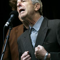 In this May 13, 2006, file photo, Leonard Cohen sings during a free concert in Toronto, Ontario. Cohen, the gravelly-voiced Canadian singer-songwriter of hits like "Hallelujah," "Suzanne" and "Bird on a Wire," has died, his management said in a statement Thursday, Nov. 10, 2016.  He was 82.